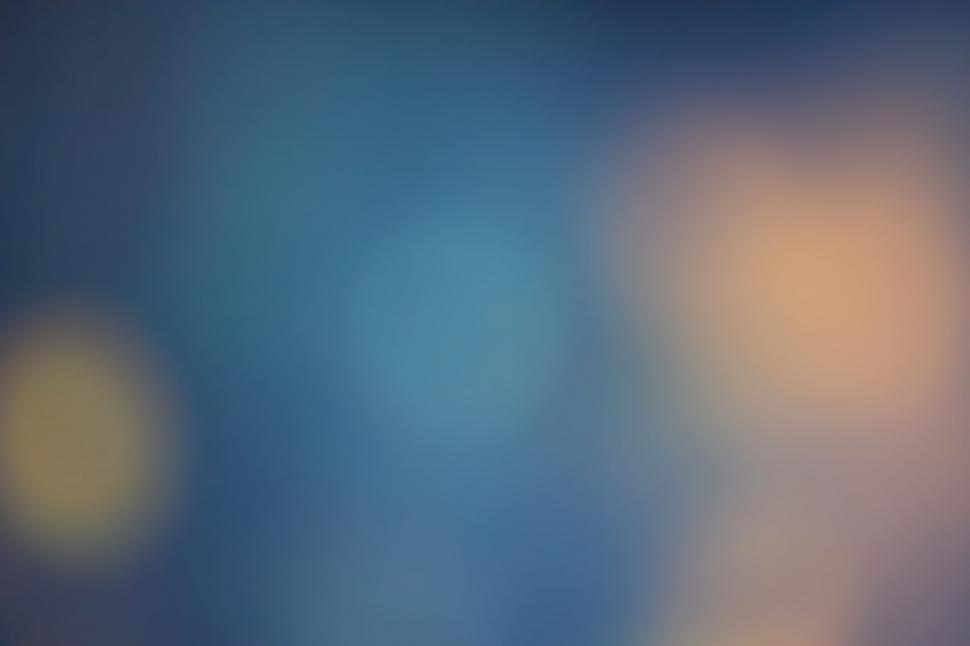 Free Image of Blurred golden and blue light background 