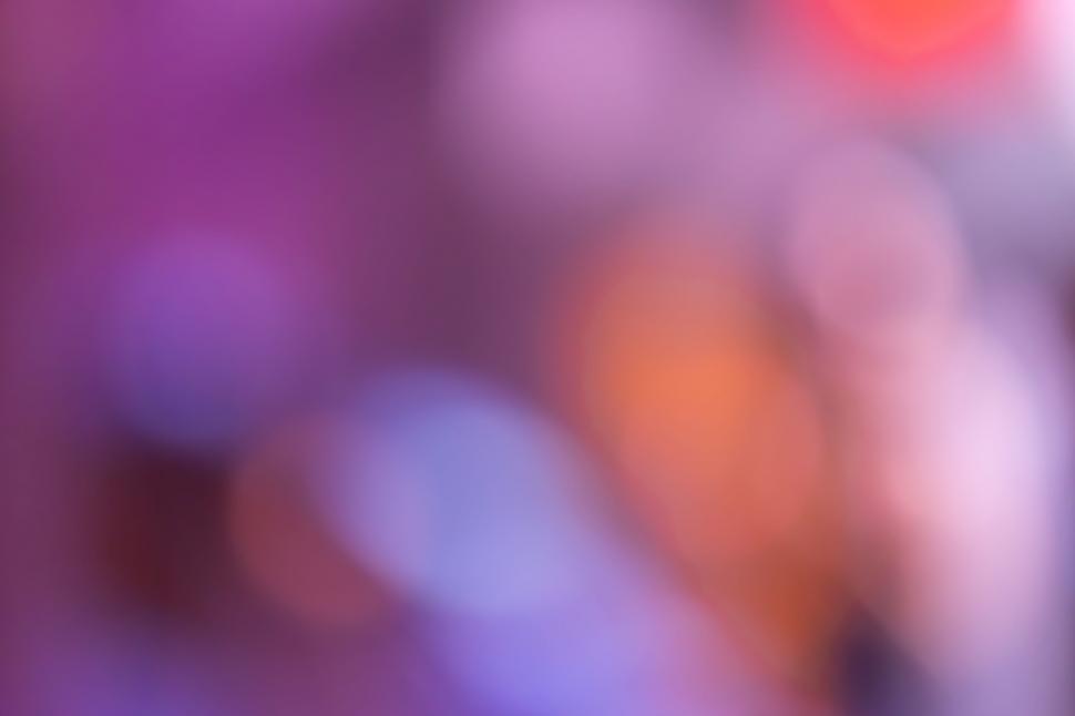 Free Image of Abstract colorful bokeh on purple backdrop 