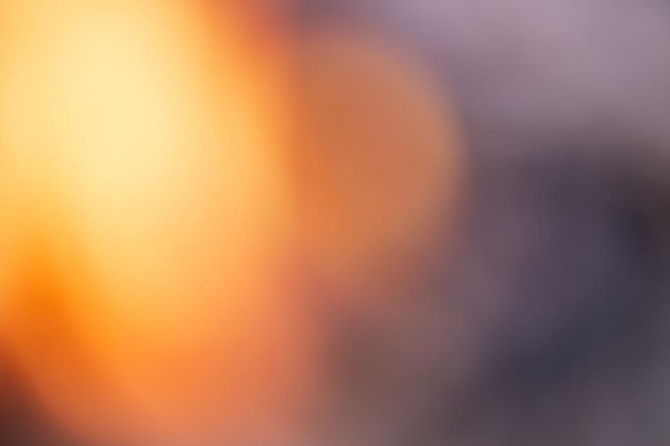 Free Image of Warm orange and brown blurred background 
