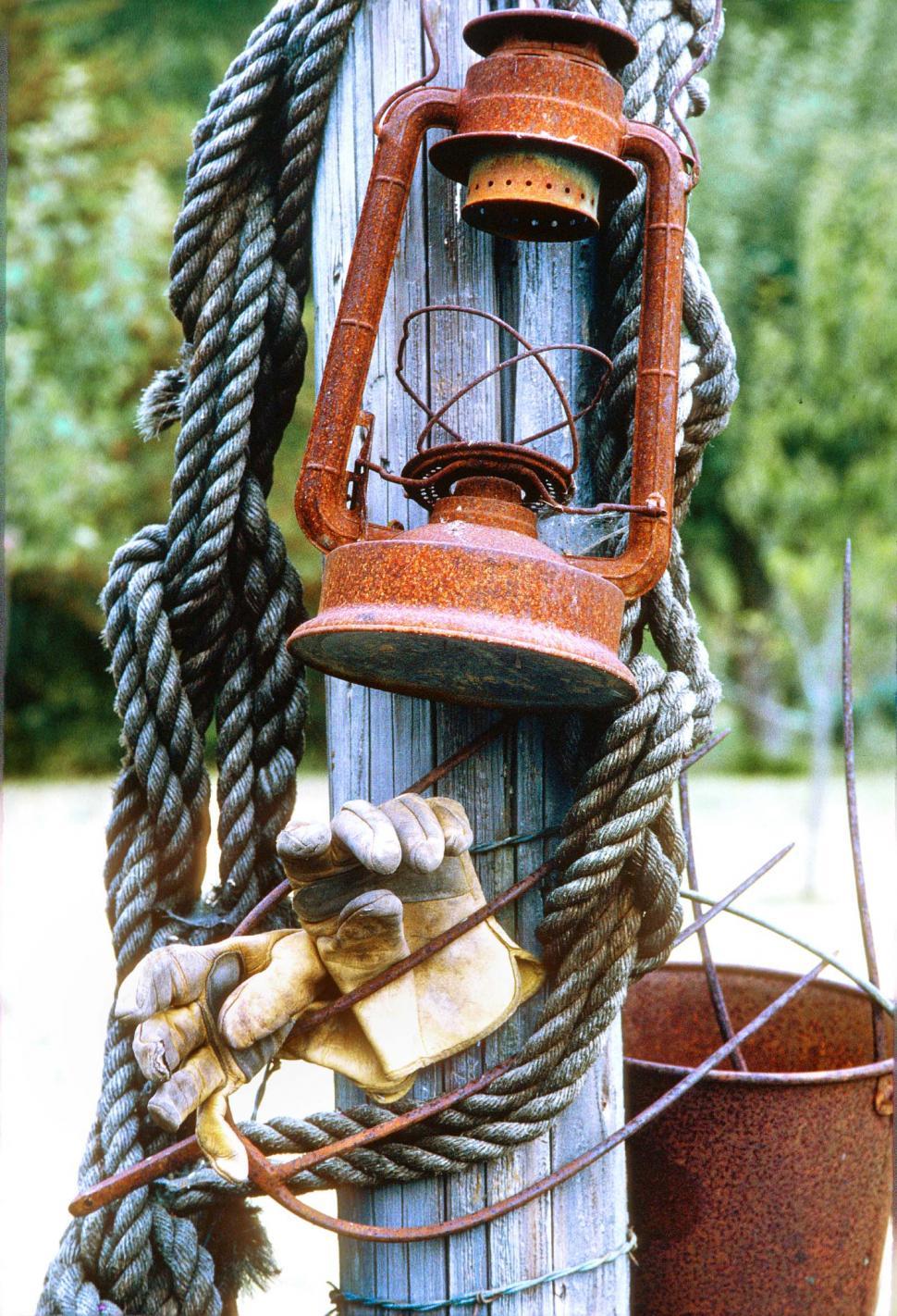 Free Image of Old lantern, rope, gloves 