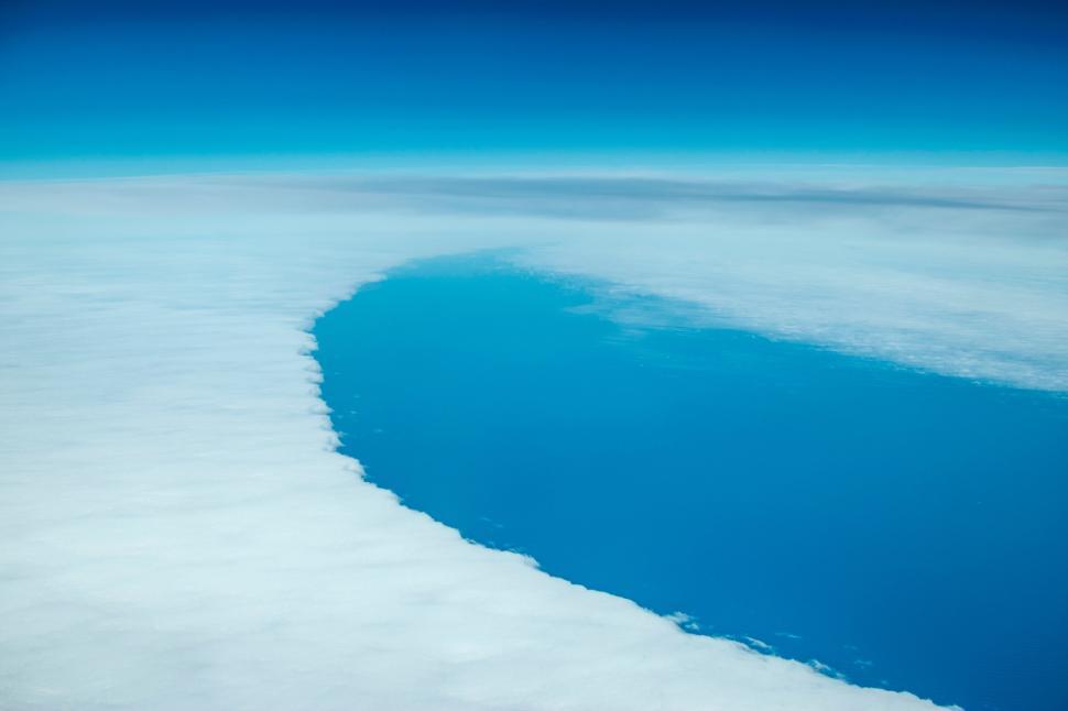 Free Image of Aerial view of cloud and ice meeting sea 
