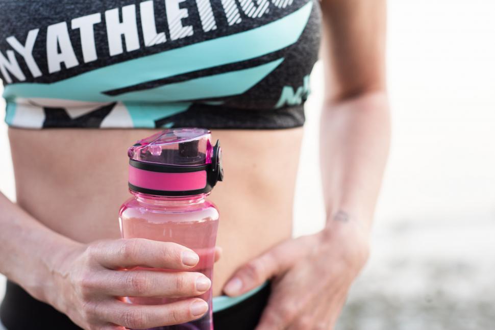 Free Image of Close-up of a woman holding a water bottle 