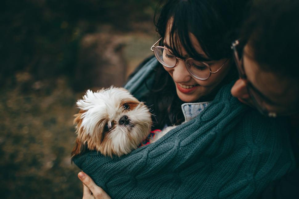 Free Image of Person with dog and obscured face 
