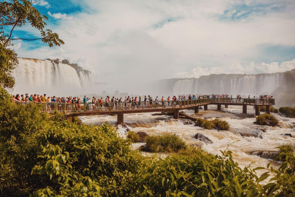 Free Image of Tourists at a large waterfall park 