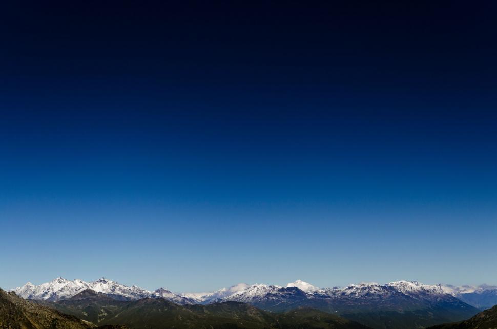 Free Image of Panoramic mountain range under clear blue sky 