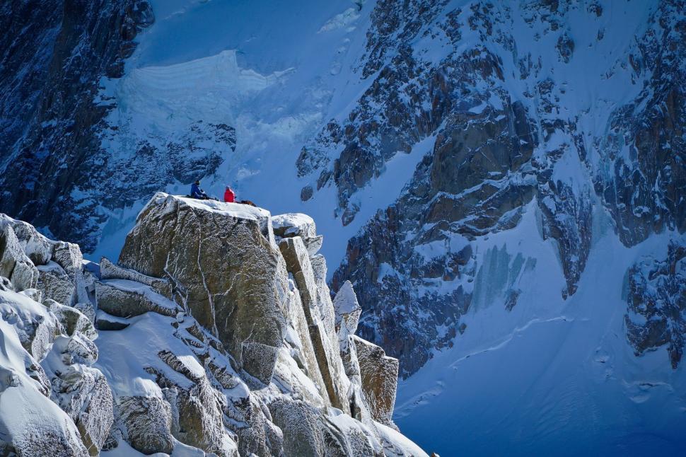 Free Image of Mountaineer on snowy ledge 