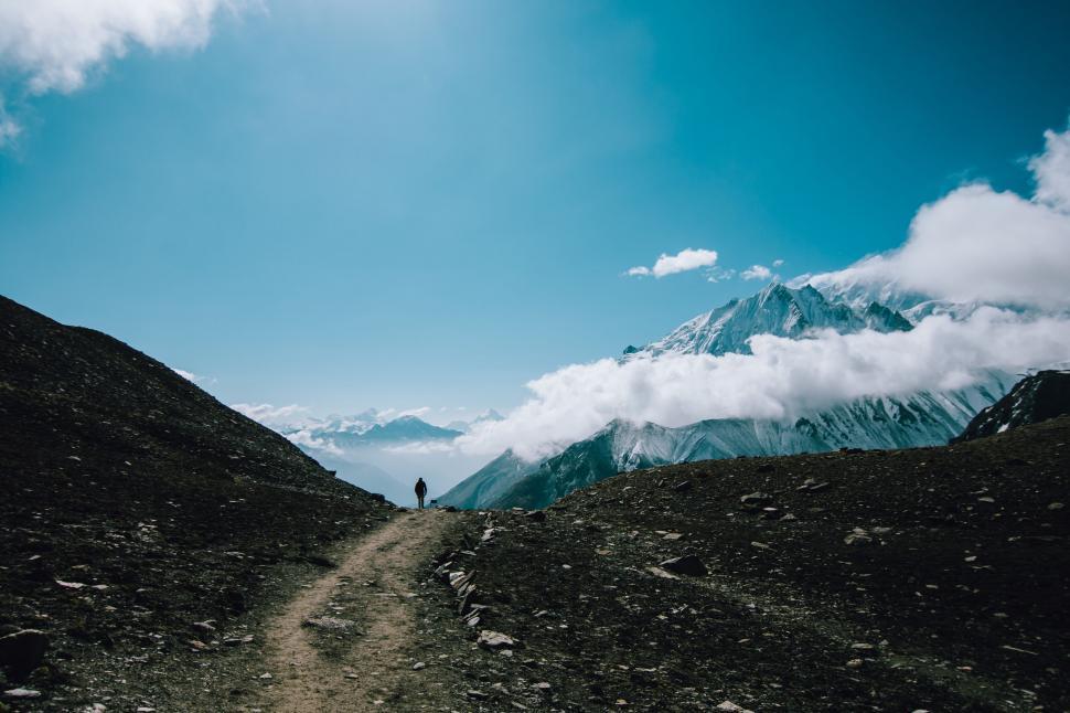 Free Image of Solo trekker on mountain path 
