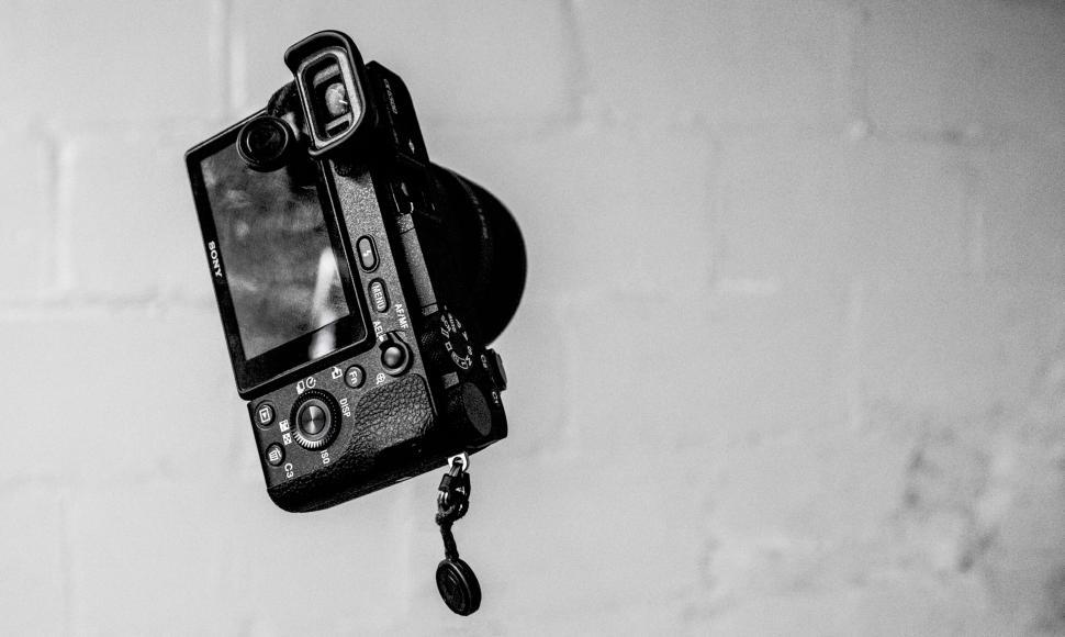 Free Image of Black and white image of a hanging camera 