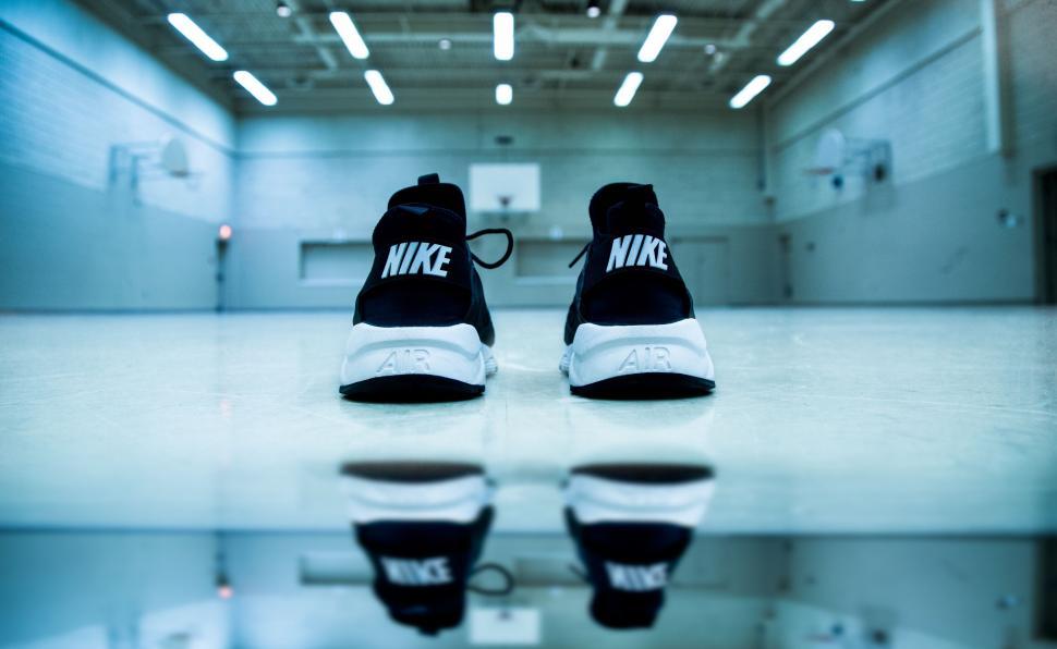 Free Image of Nike sneakers in gym with reflection 