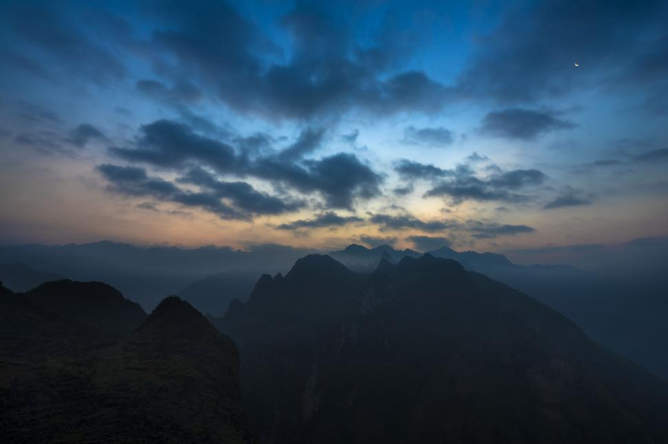 Free Image of Twilight over mountainous terrain and sky 