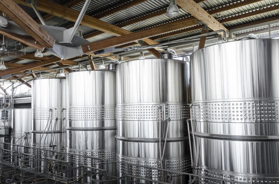 Free Image of Interior of a brewery with metallic tanks 