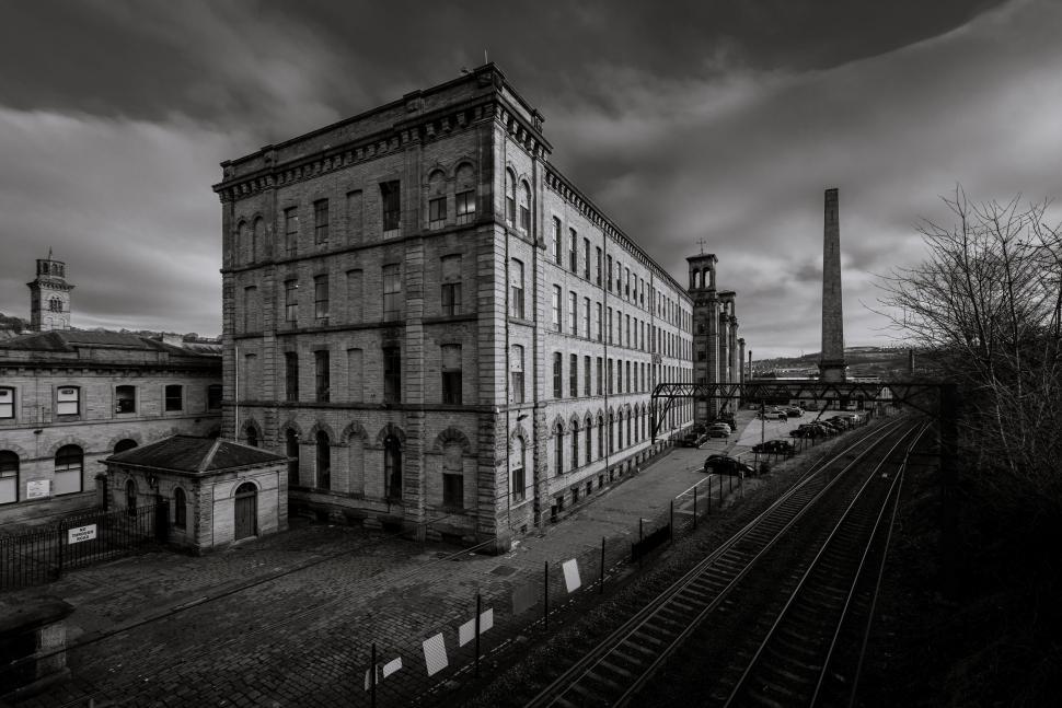 Free Image of Historic industrial building and smokestack 