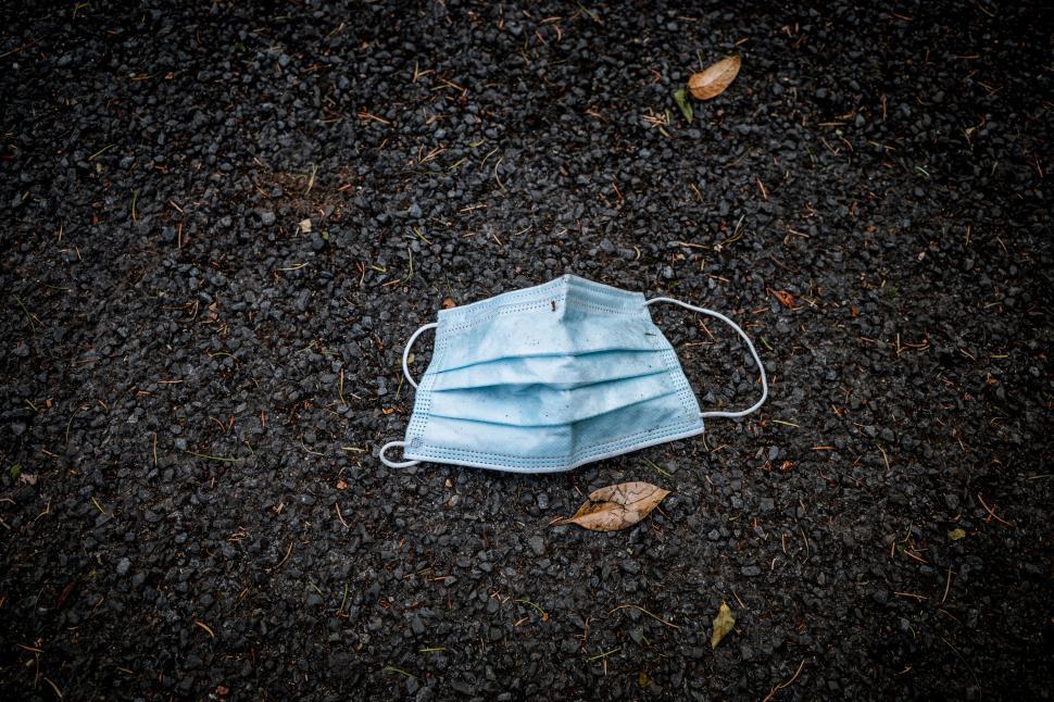 Free Image of Discarded face mask on ground outdoors 