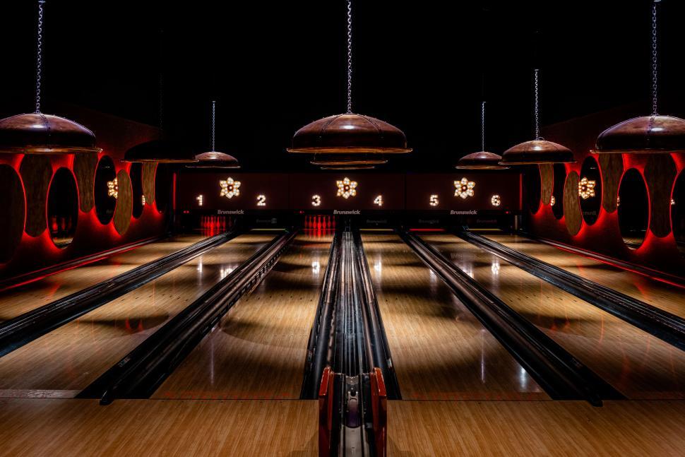 Free Image of Stylish bowling alley with red accents 