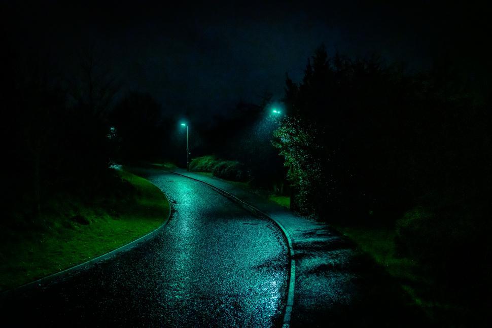 Free Image of Rainy night street with illuminated streetlights 