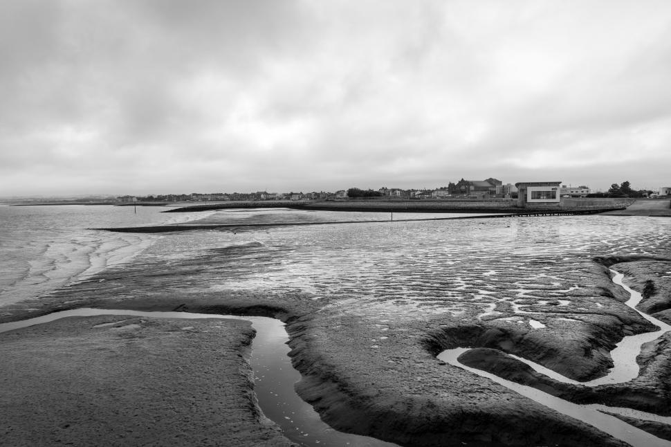 Free Image of Black and white beach landscape with ripples 