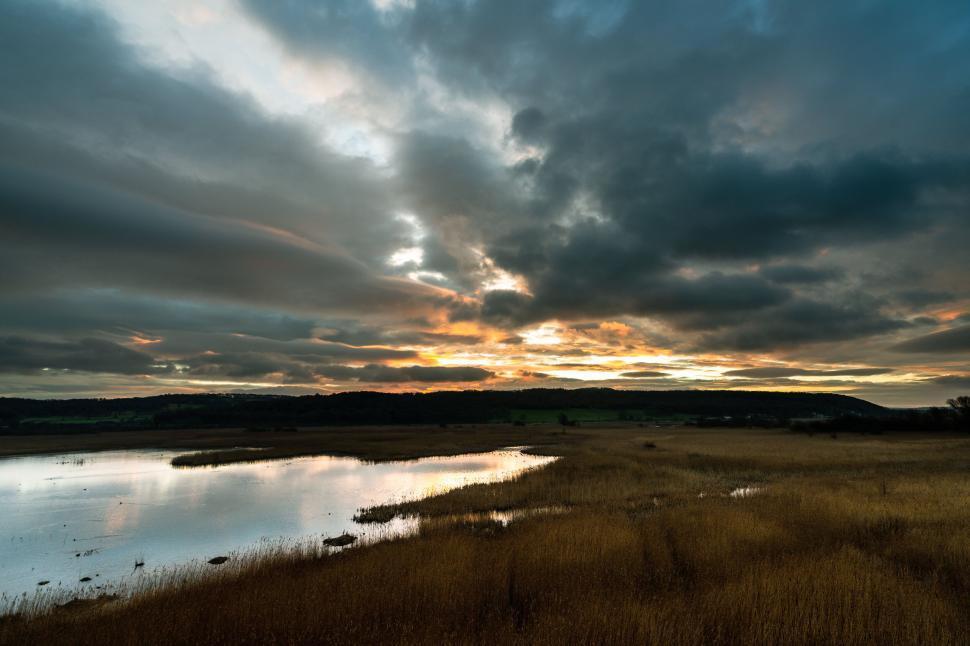 Free Image of Sunset over a waterlogged field 