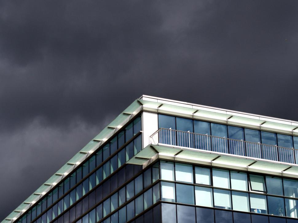 Free Image of Edgy modern building against stormy skies 