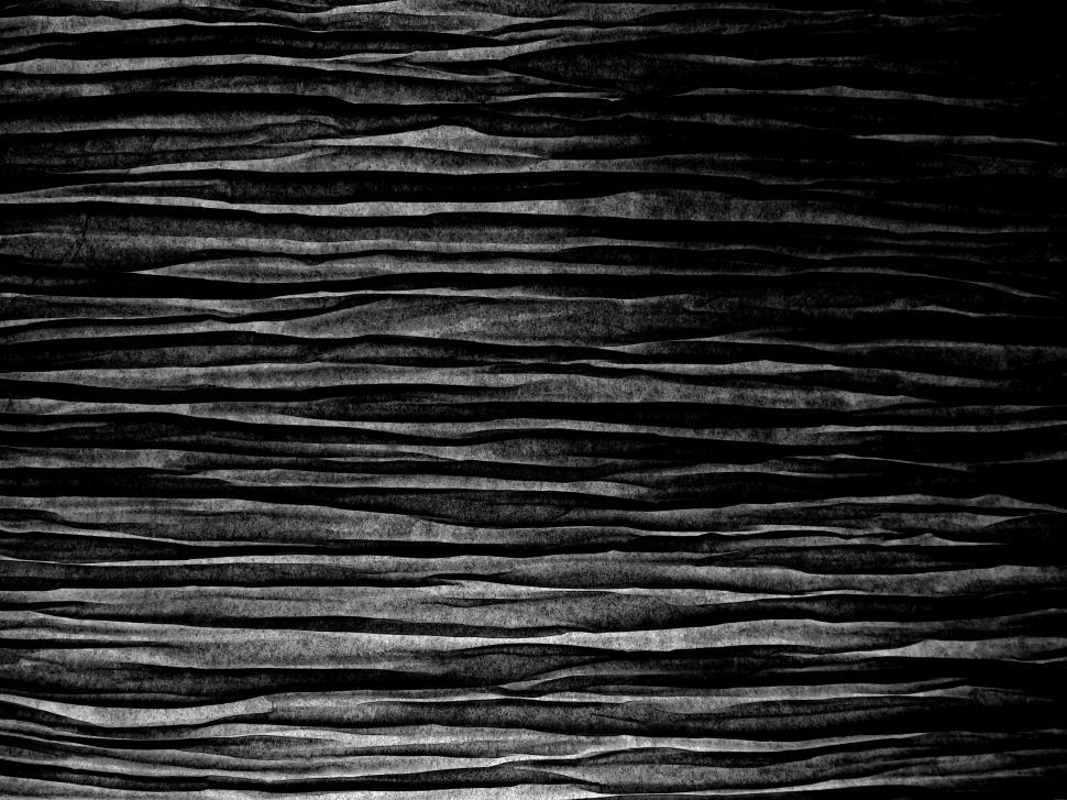 Free Image of Black textured fabric background close up 