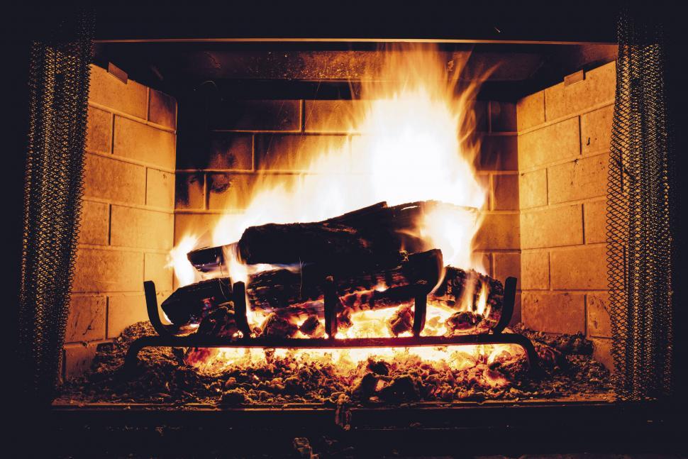 Free Image of Cozy fireplace with burning logs in home 
