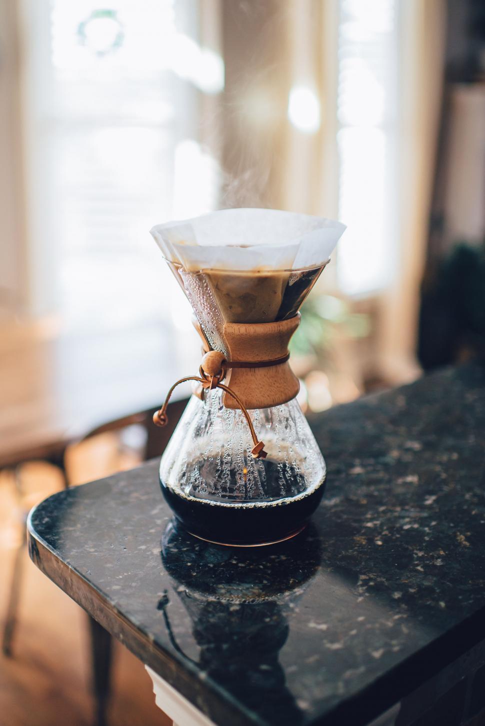 Free Image of Pouring coffee through filter at home 