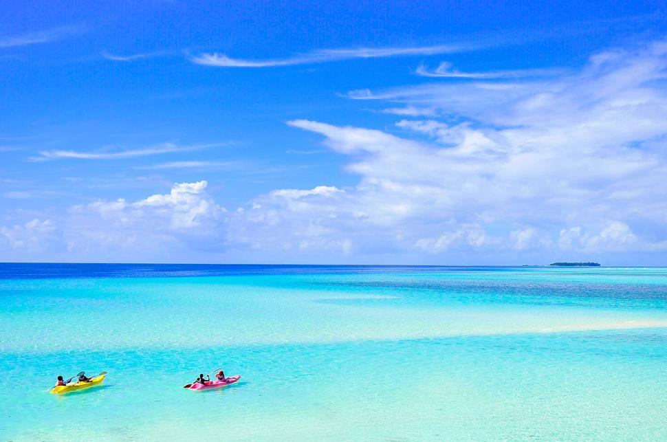 Free Image of Kayakers on a tropical blue ocean 