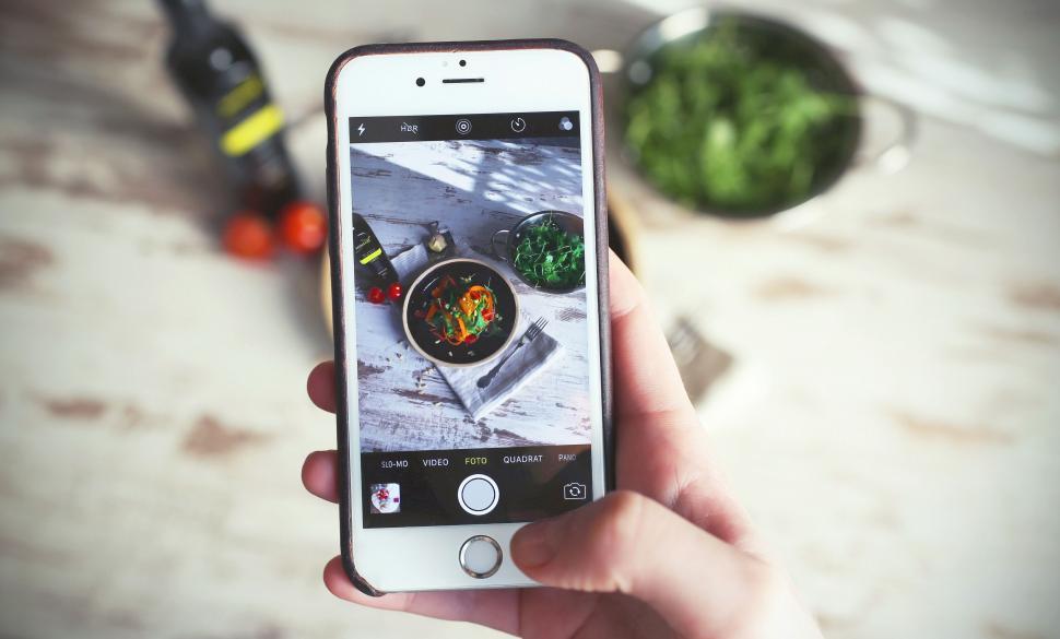 Free Image of Smartphone capturing food preparation 