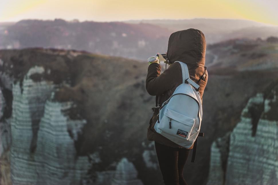 Free Image of Person with backpack hiking at sunset 