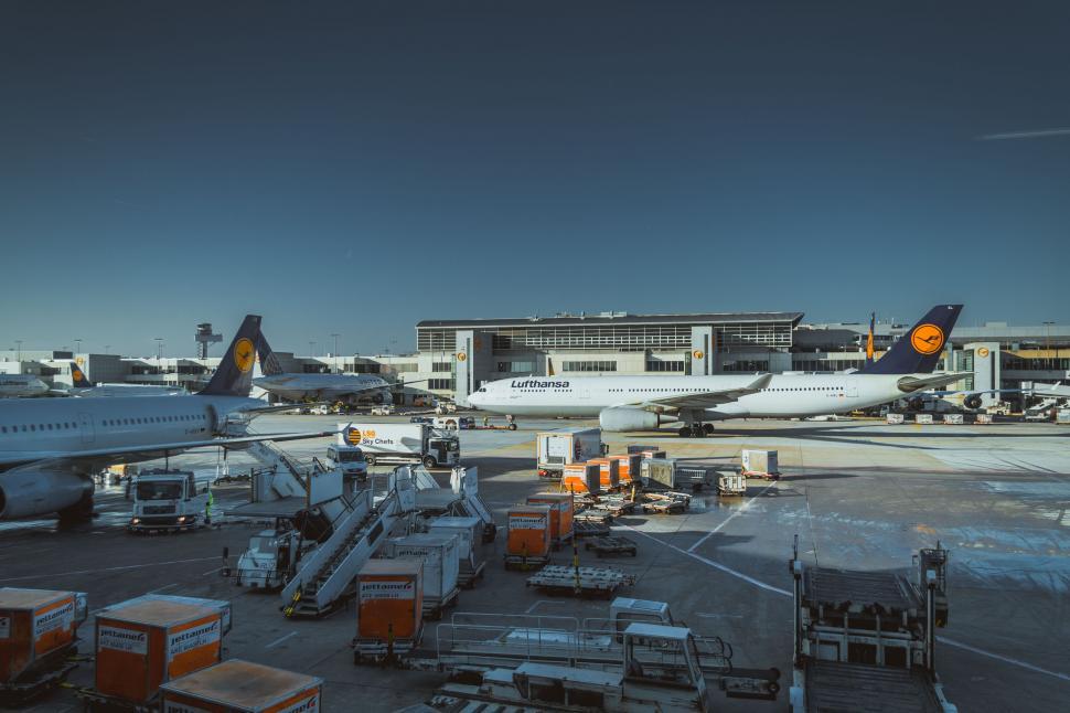 Free Image of Airport apron with planes and vehicles 