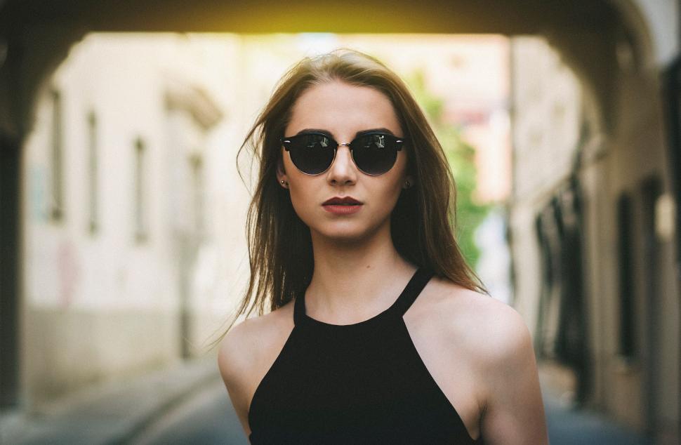 Free Image of Woman in sunglasses on urban street 