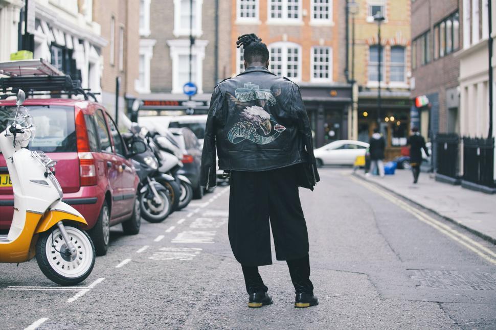 Free Image of Person with a punk style jacket from behind 