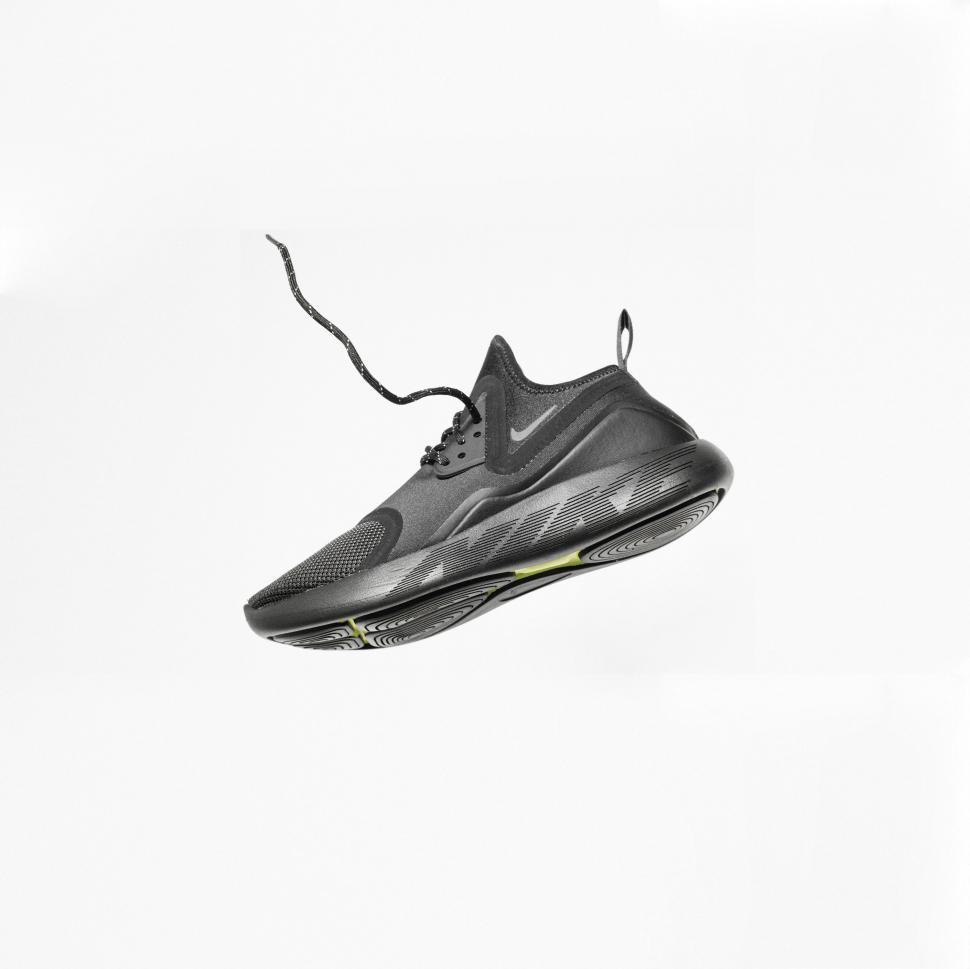Free Image of Floating black sneaker on white background 