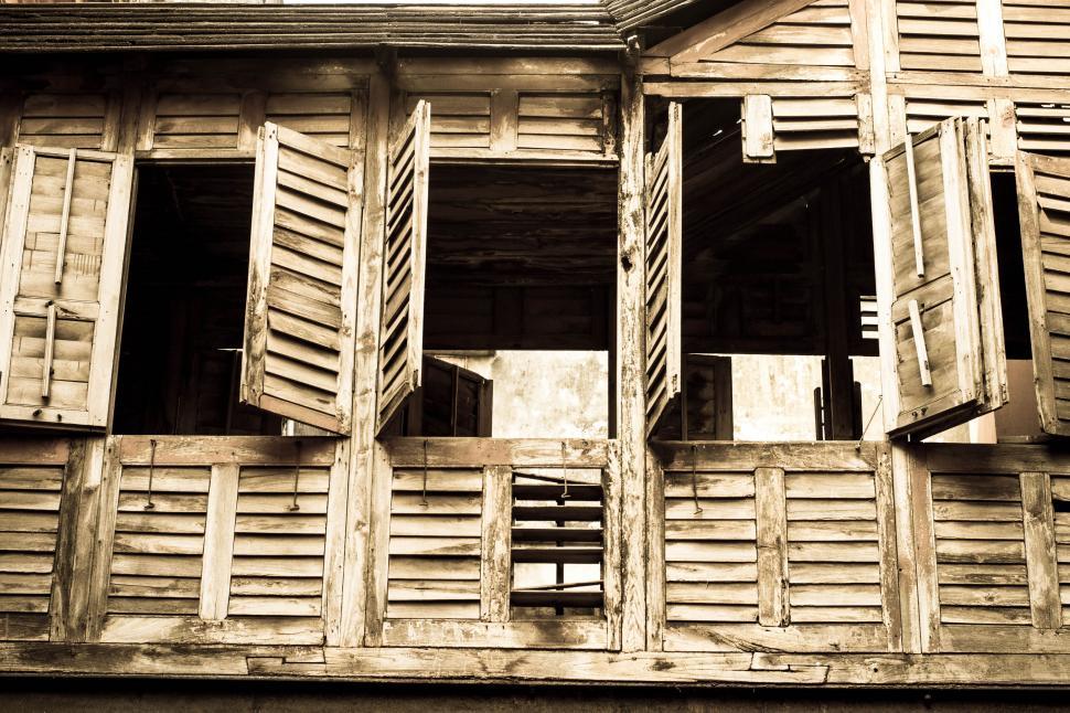 Free Image of Weathered wooden shutters on old house 