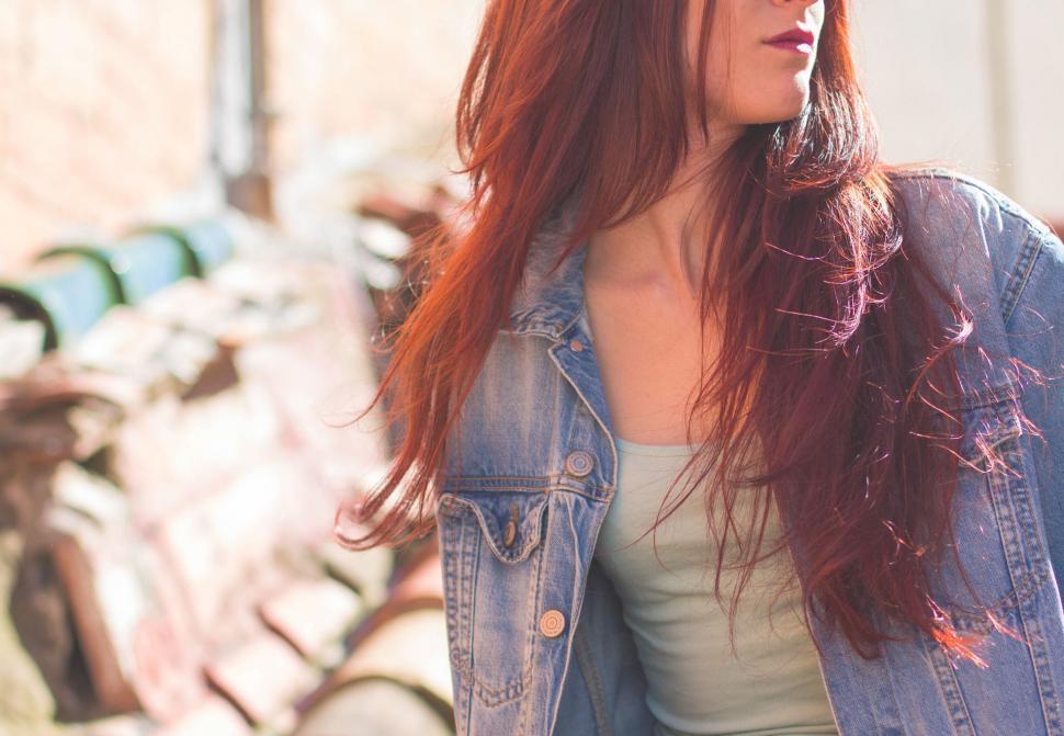 Free Image of Woman with red hair in sunlight 