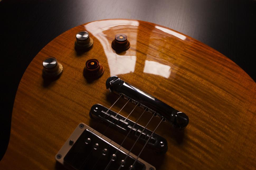 Free Image of Detail of a Gibson Les Paul guitar body 