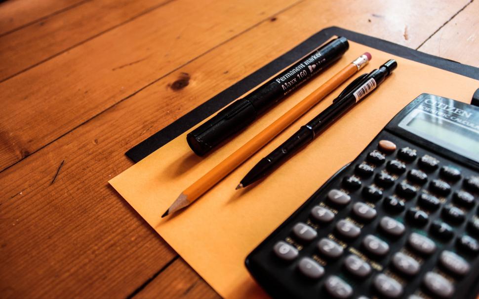 Free Image of Office supplies on a wooden desk 