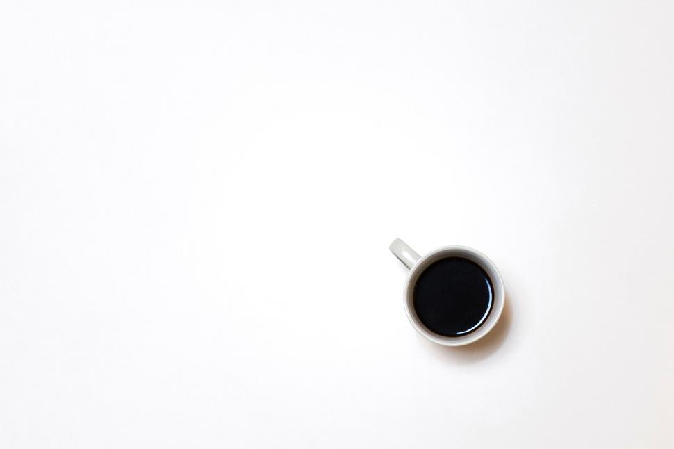 Free Image of Minimalist cup of coffee on white background 