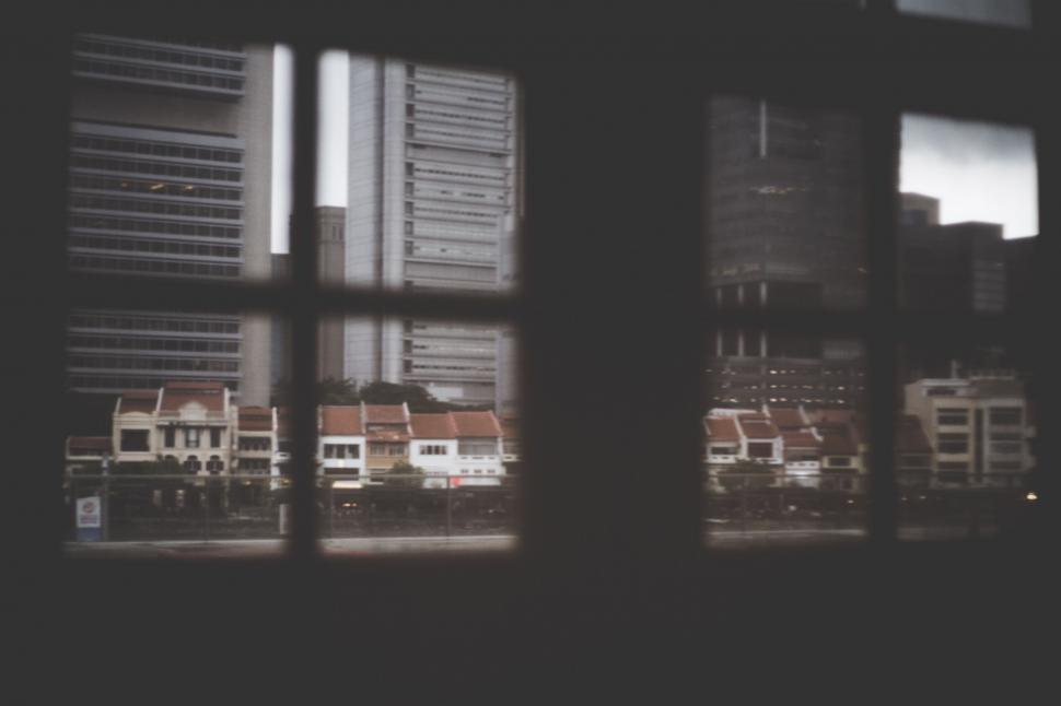 Free Image of Urban view through a windowpane 
