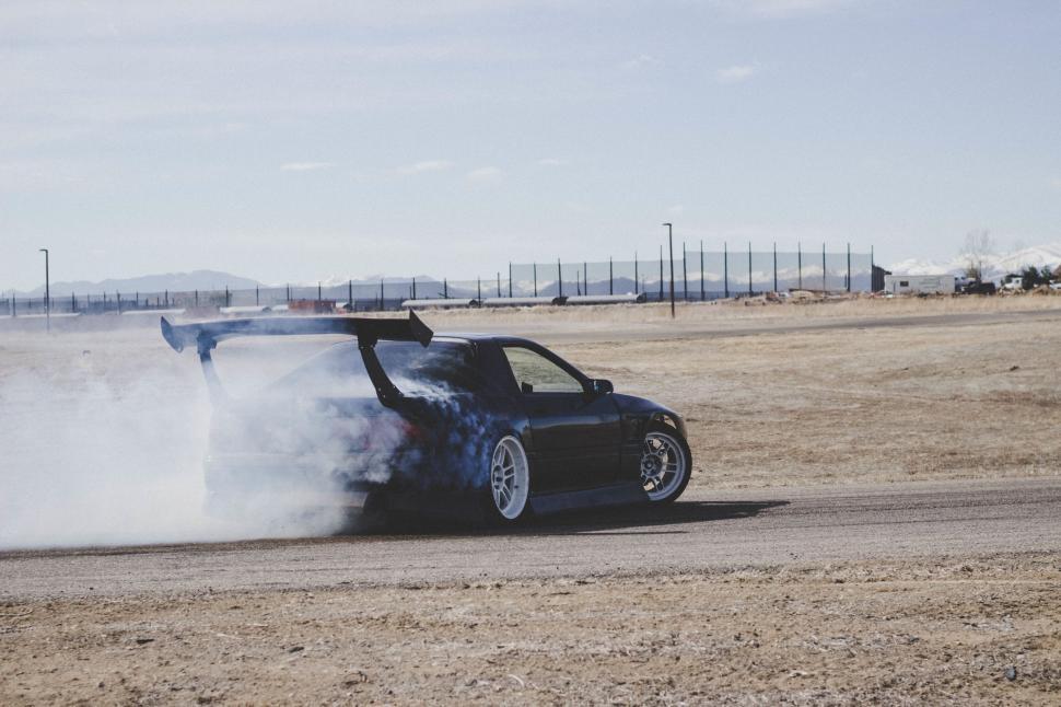 Free Image of Drifting car in a dust cloud 
