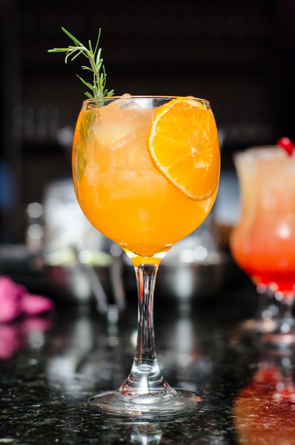Free Image of Refreshing orange cocktail with garnish 