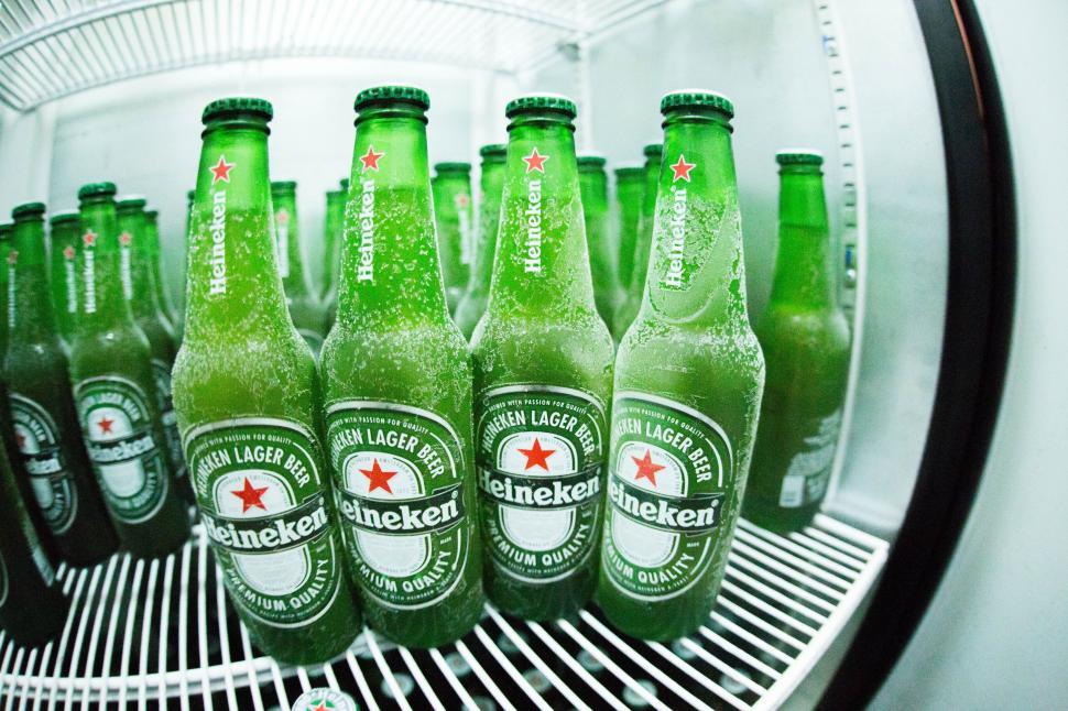Free Image of Chilled beers in a fridge with branding 