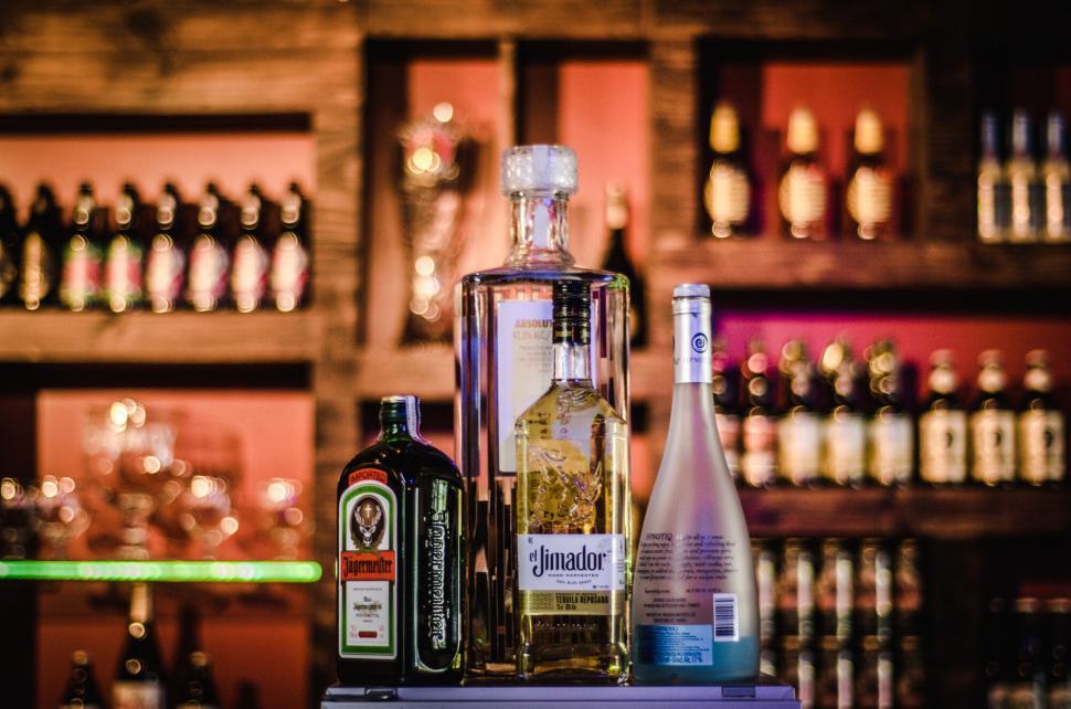 Free Image of Bottles of liquor on a bar counter 