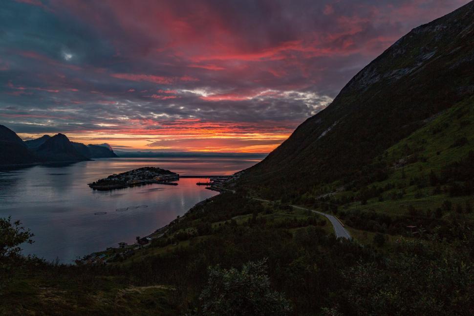 Free Image of Sunset over a fjord with coastal road 