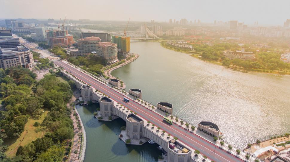 Free Image of Aerial view of a city bridge over a river 