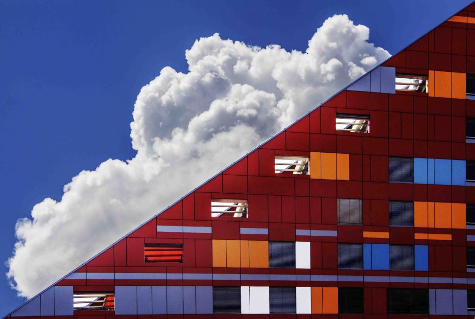 Free Image of Colorful building facade with cloud reflection 