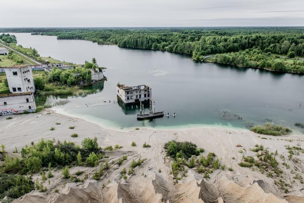 Free Image of Aerial view of abandoned building by river 