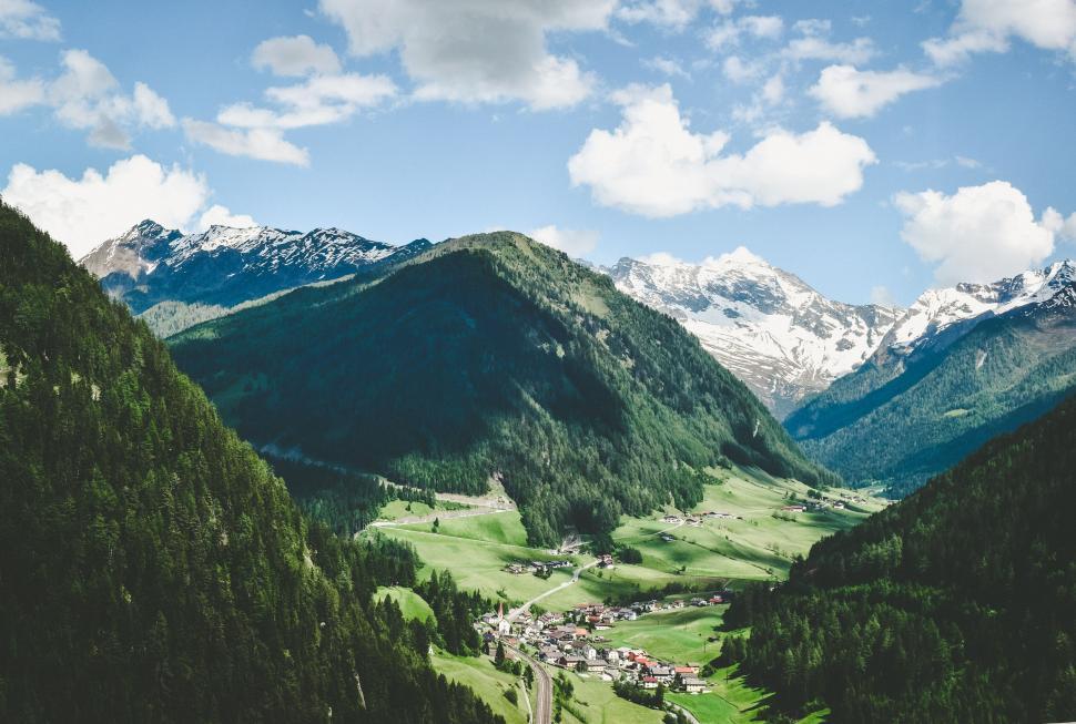 Free Image of Alpine village nestled in lush valley 