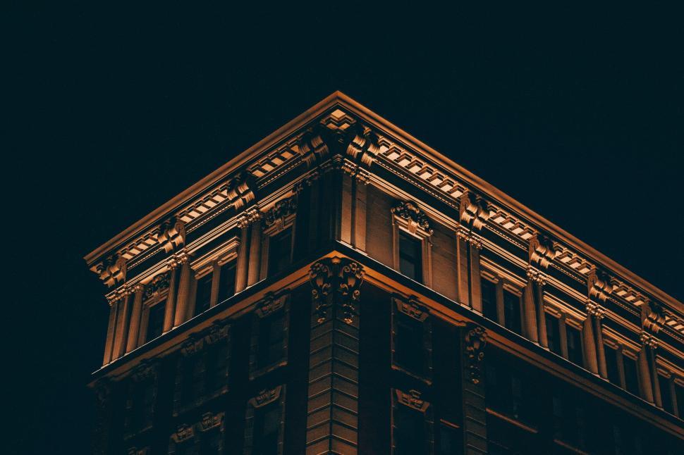 Free Image of Historic building corner illuminated at night 