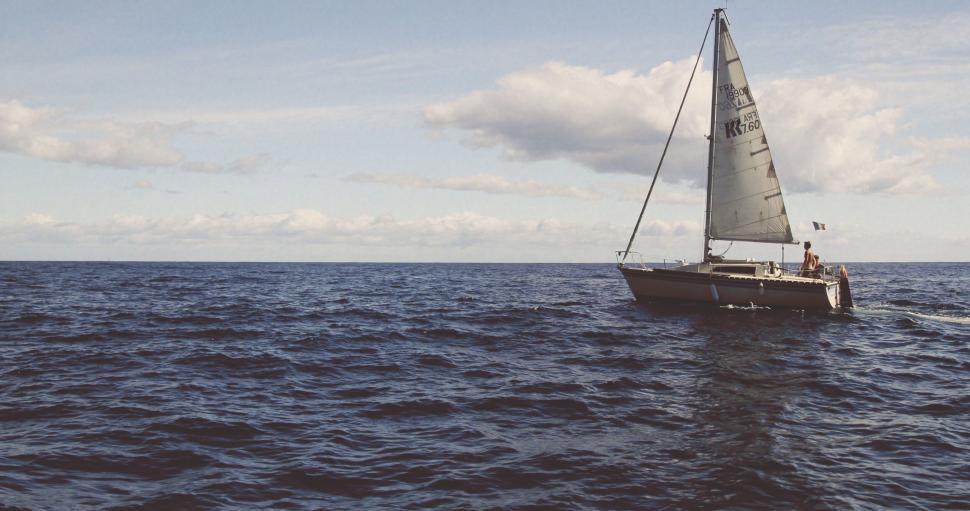 Free Image of Sailboat cruising on the open sea 