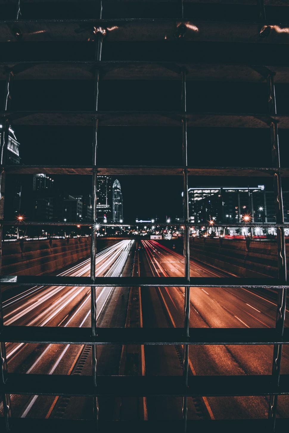 Free Image of Urban scene seen through a fence 